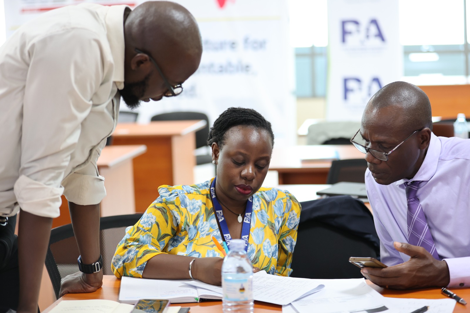 Procurement officers working through portal exercises at the Kampala training